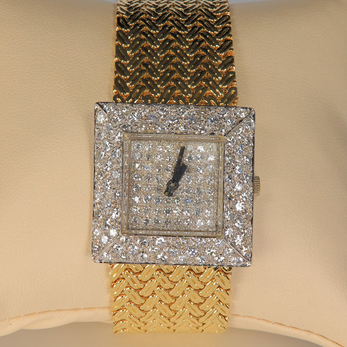 white and yellow gold estate watch with diamonds