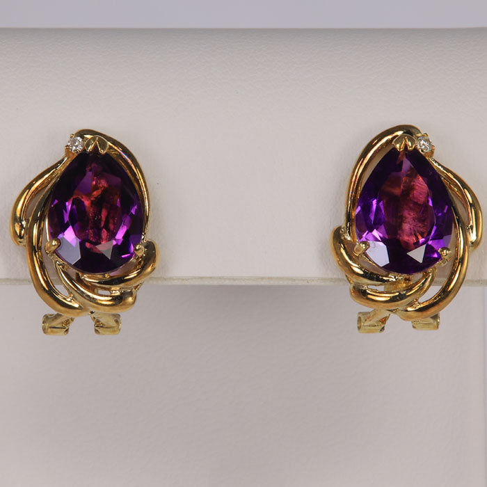 pear shape amethyst studs with diamond accent in yellow gold