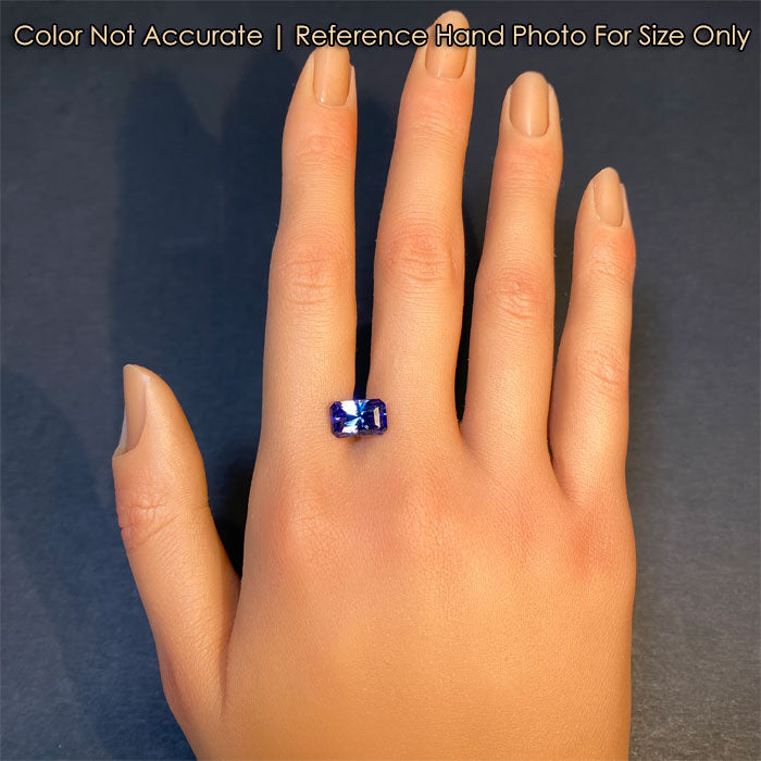 mostly blue tanzanite gemstone barion style emerald cut on hand