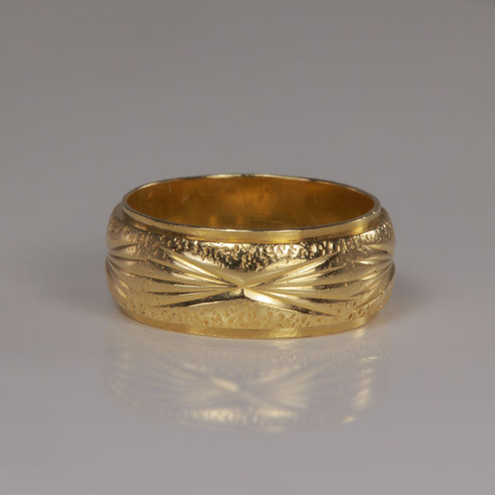 yellow gold band with engraved detail