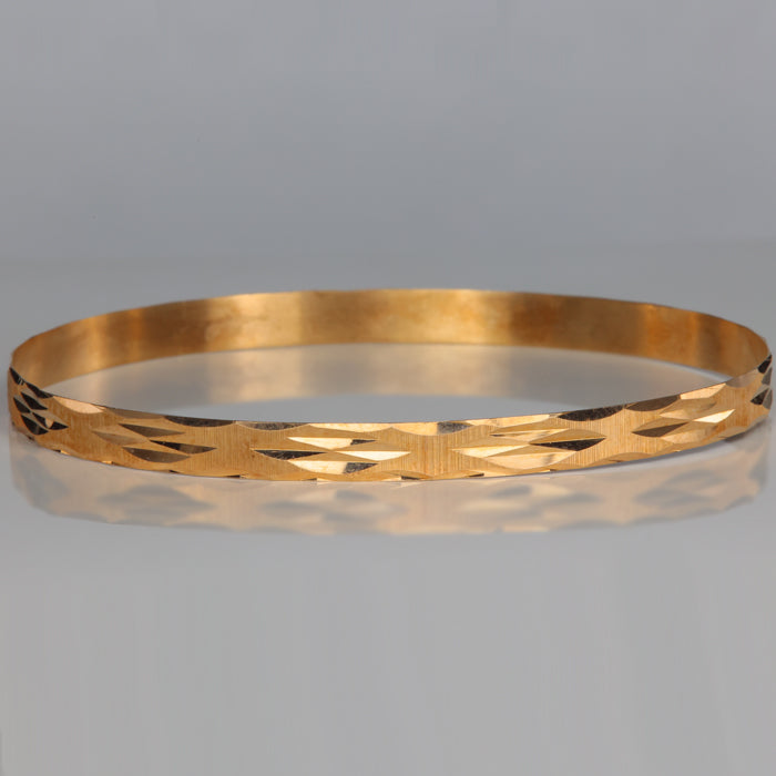 yellow gold diamond cut bangle bracelet