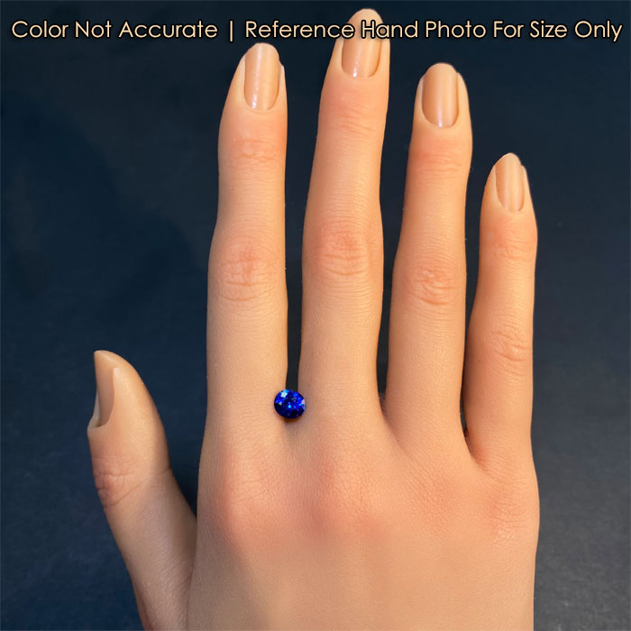 sapphire gemstone on hand blue color oval cut