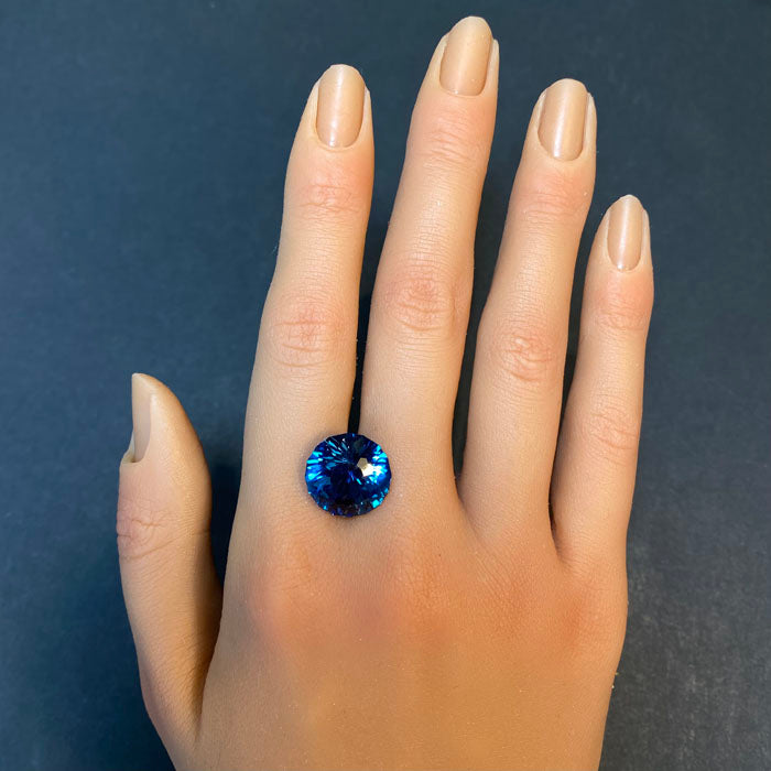 london blue topaz gemstone on hand