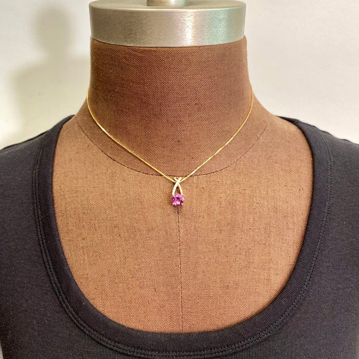 pink garnet pendant with diamonds in yellow gold