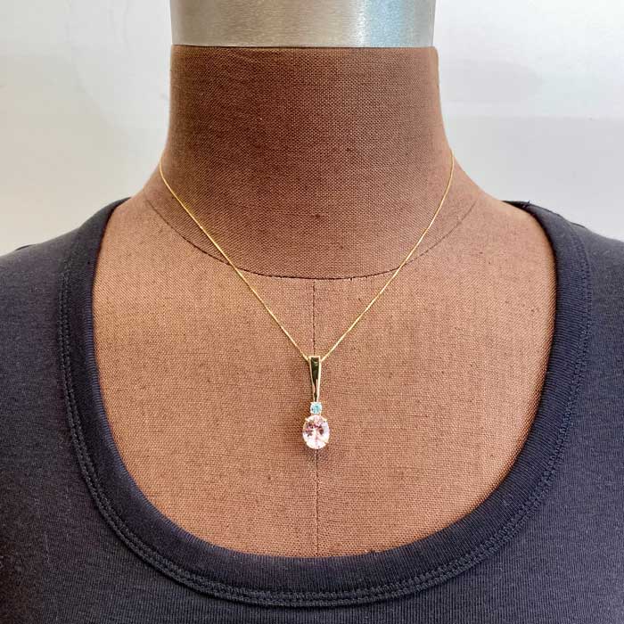 peach morganite pendant in yellow gold with blue zircon accent