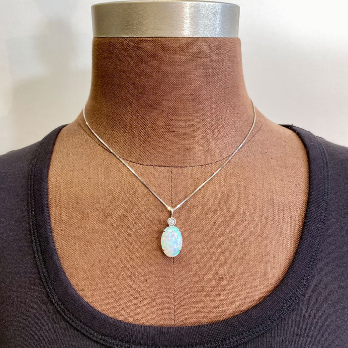 opal pendant in white gold with diamond accent 