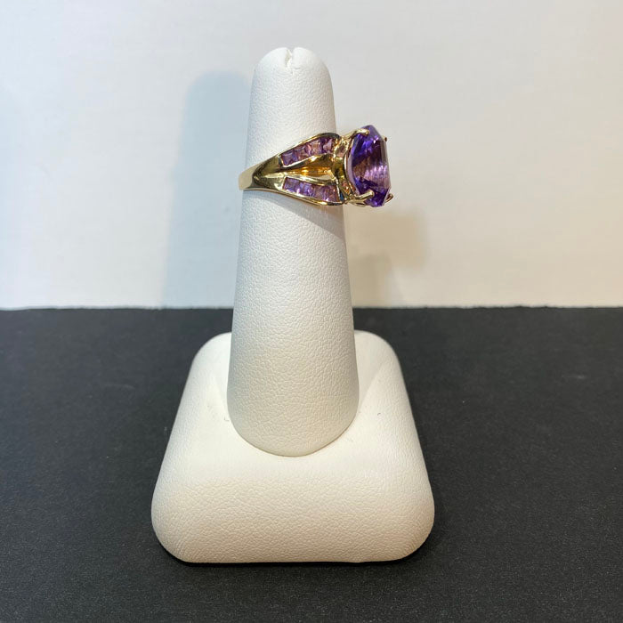 yellow gold and oval fantasy cut amethyst ring