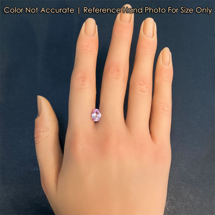 sapphire gemstone oval cut on hand pink color 