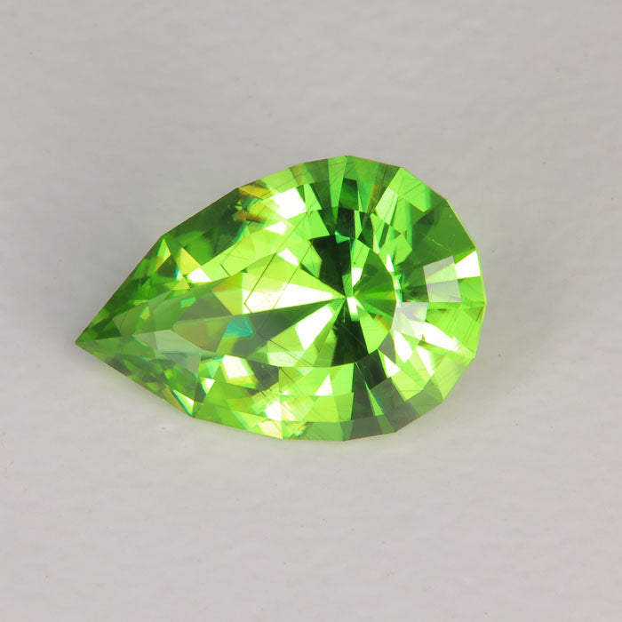 pear shape brilliant peridot gemstone bluish green