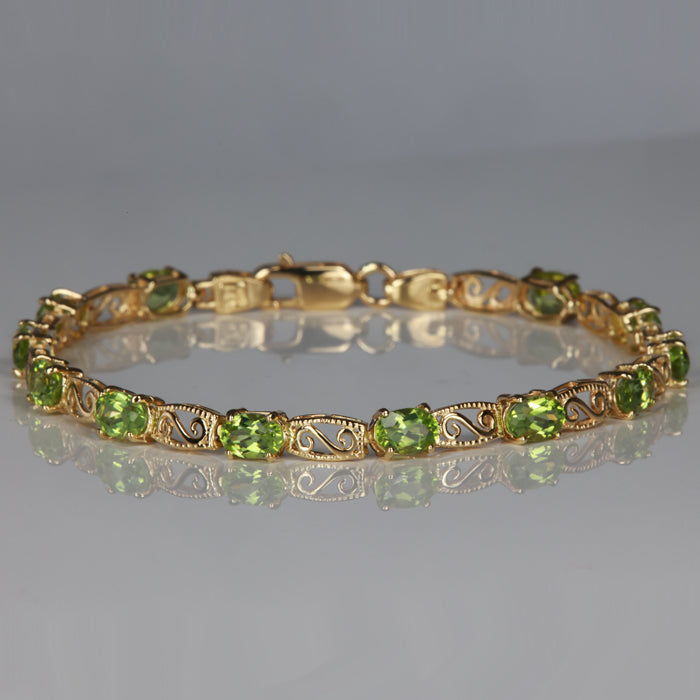 gold and oval cut peridot gemstone bracelet