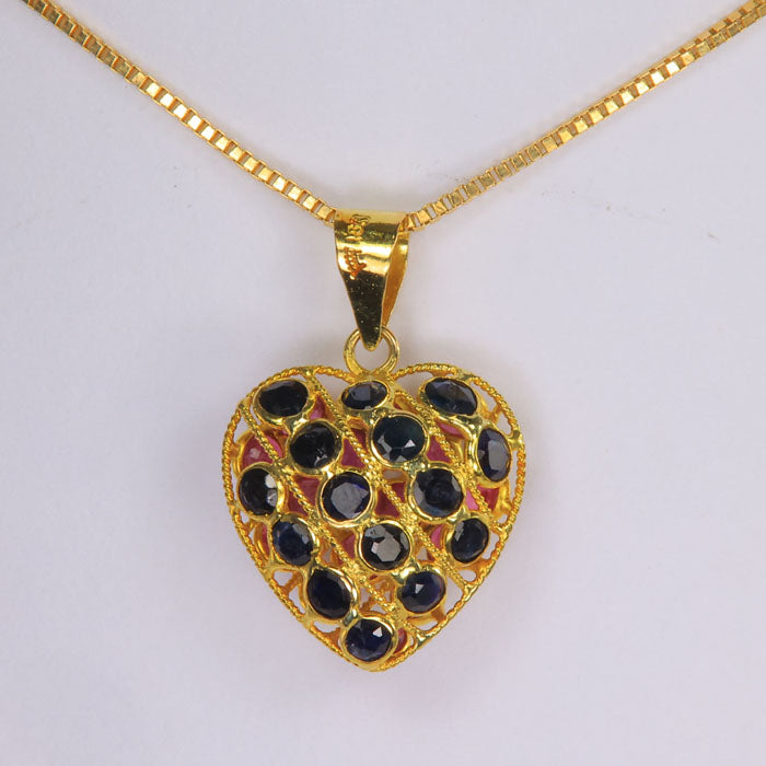 sapphire and ruby reversible heart pendant in yellow gold
