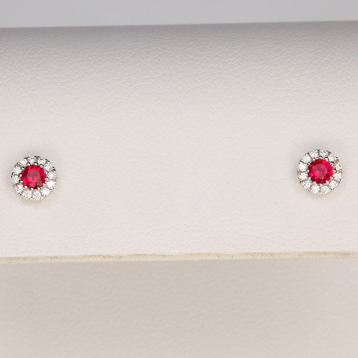 white gold diamond halo and ruby stud earrings 