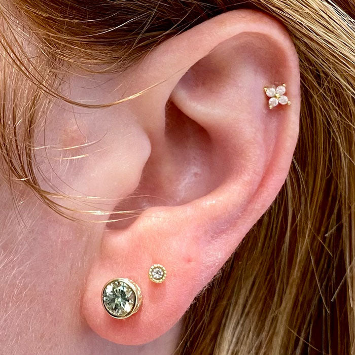 sapphire stud earrings on ear