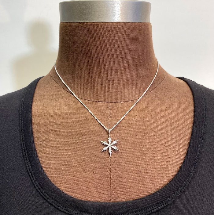 white gold snowflake pendant with diamonds