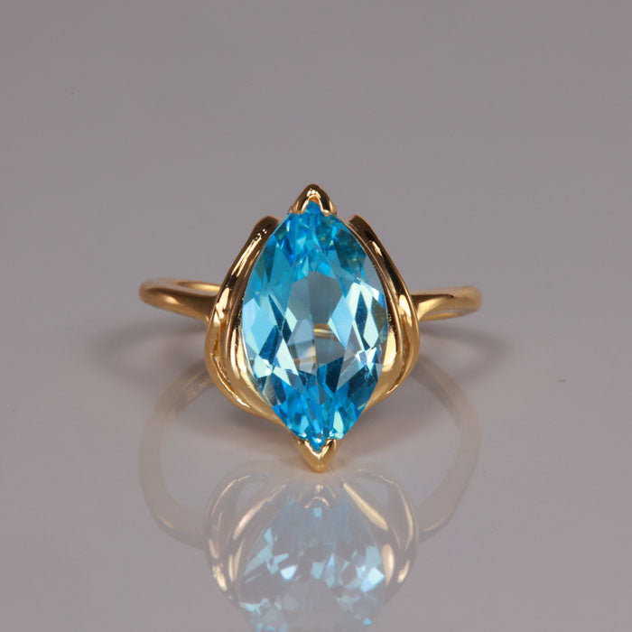 yellow gold estate ring with swiss blue topaz