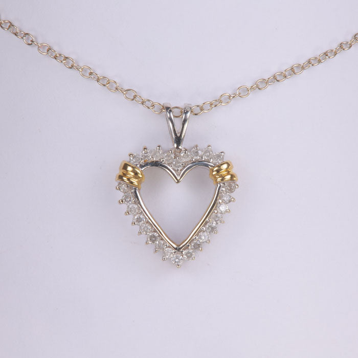 heart pendant in white and yellow gold with diamonds