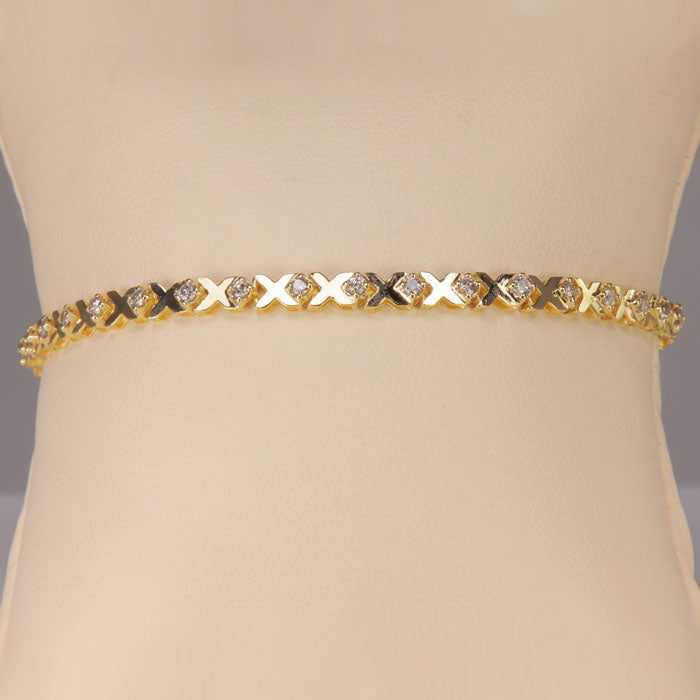 yellow gold bracelet with diamonds and xoxo design