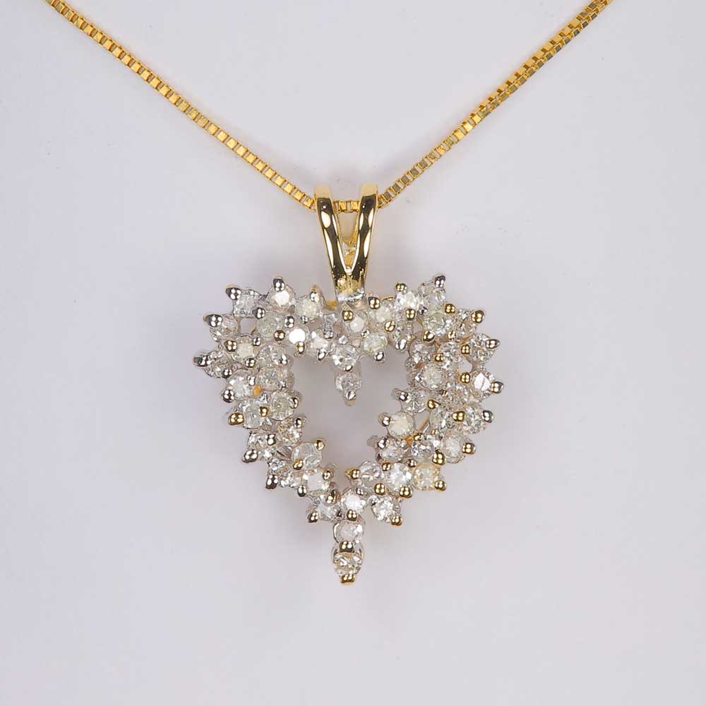 heart pendant with diamonds in yellow gold