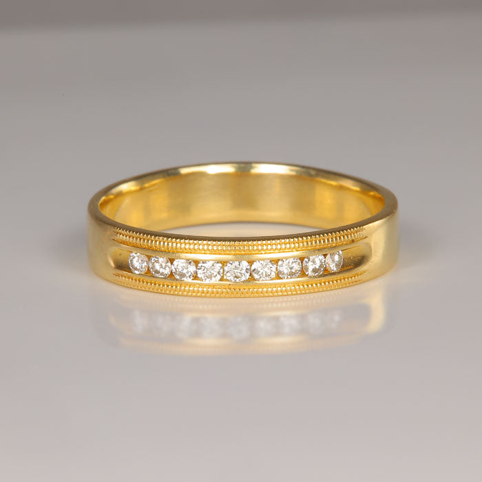 diamond band set in yellow gold 