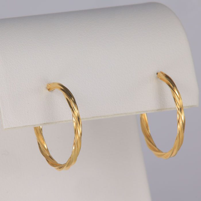 twist style hoop earrings yellow gold