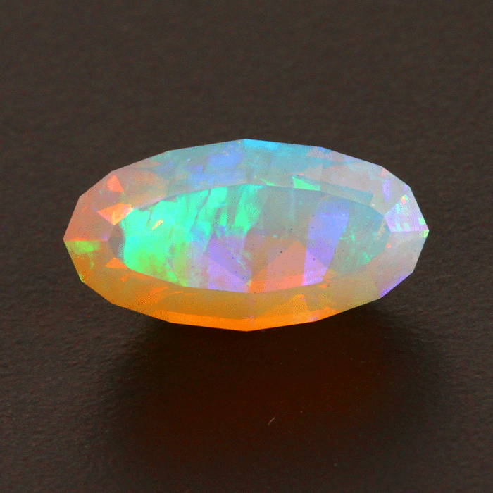 On Hold for Jane Faceted Oval Welo Opal Gemstone 6.65 Carats